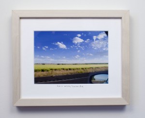 framed photograph, taken from car while driving across USA, with title handwritten on matt