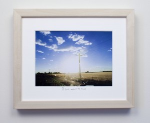 framed photograph, taken from car while driving across USA, with title handwritten on matt