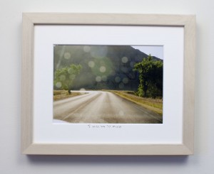 framed photograph, taken from car while driving across USA, with title handwritten on matt