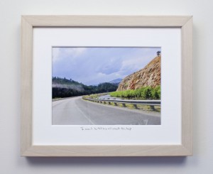 framed photograph, taken from car while driving across USA, with title handwritten on matt